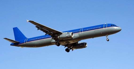 Blue sky with big passenger airplane landing in airport of Palma de Mallorca
